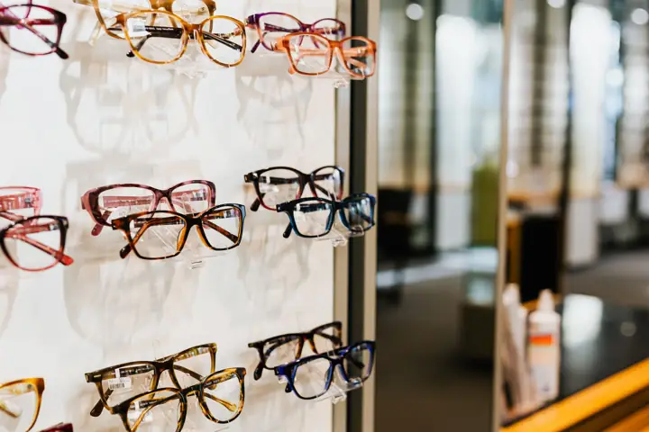 Wall display of prescription frames in many colours